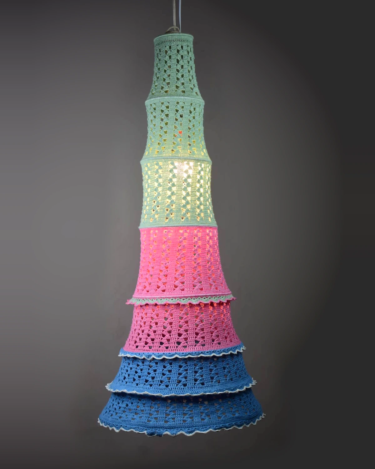 Tall tiered pendant lamp in mint, pink and blue crochet.