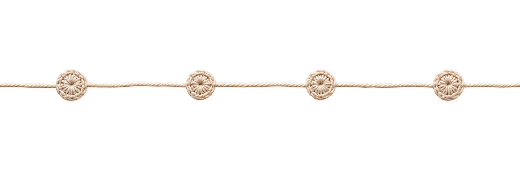 A crochet thread with small round crochet knots along it.